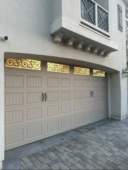Ornate beige garage door with decorative windows in Orange County