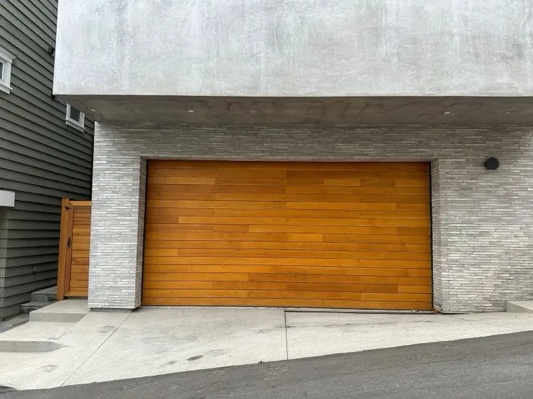 Custom wood-look modern garage door on a contemporary Orange County home