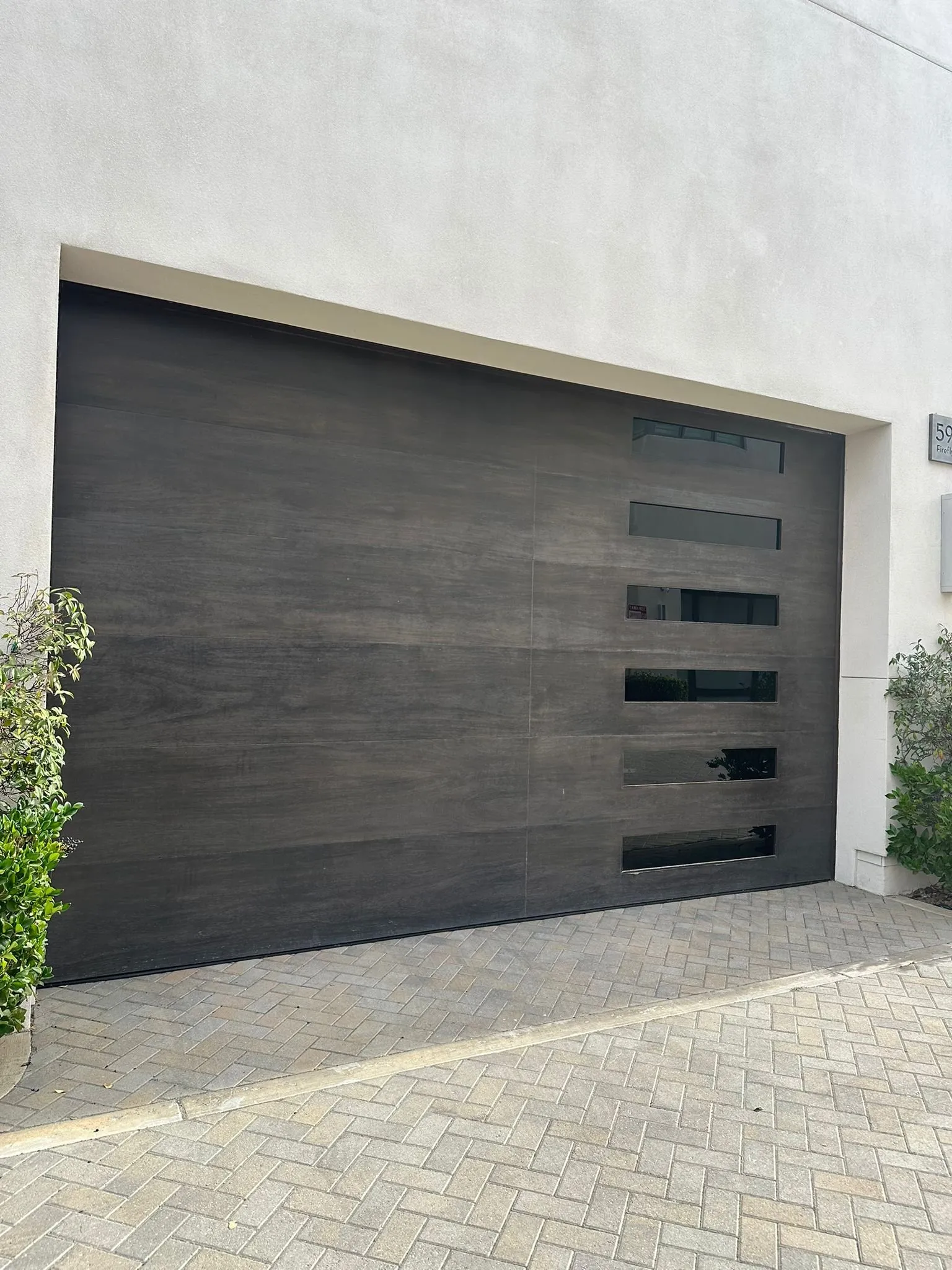Gray commercial roll-up shutter guarding a warehouse opening — roll-up door repair in Orange County