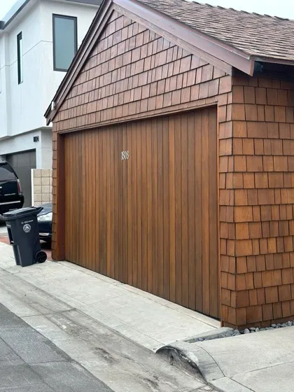 Flush-panel modern garage door in dark bronze with clerestory windows — flush modern doors in Irvine, CA